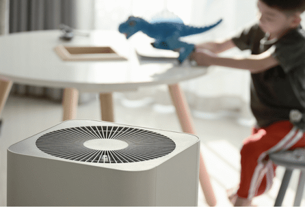 Air purifier in front of a child