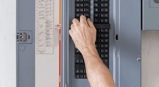 Hand toggling electrical breaker switches