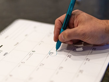 hand scheduling maintenance on calendar