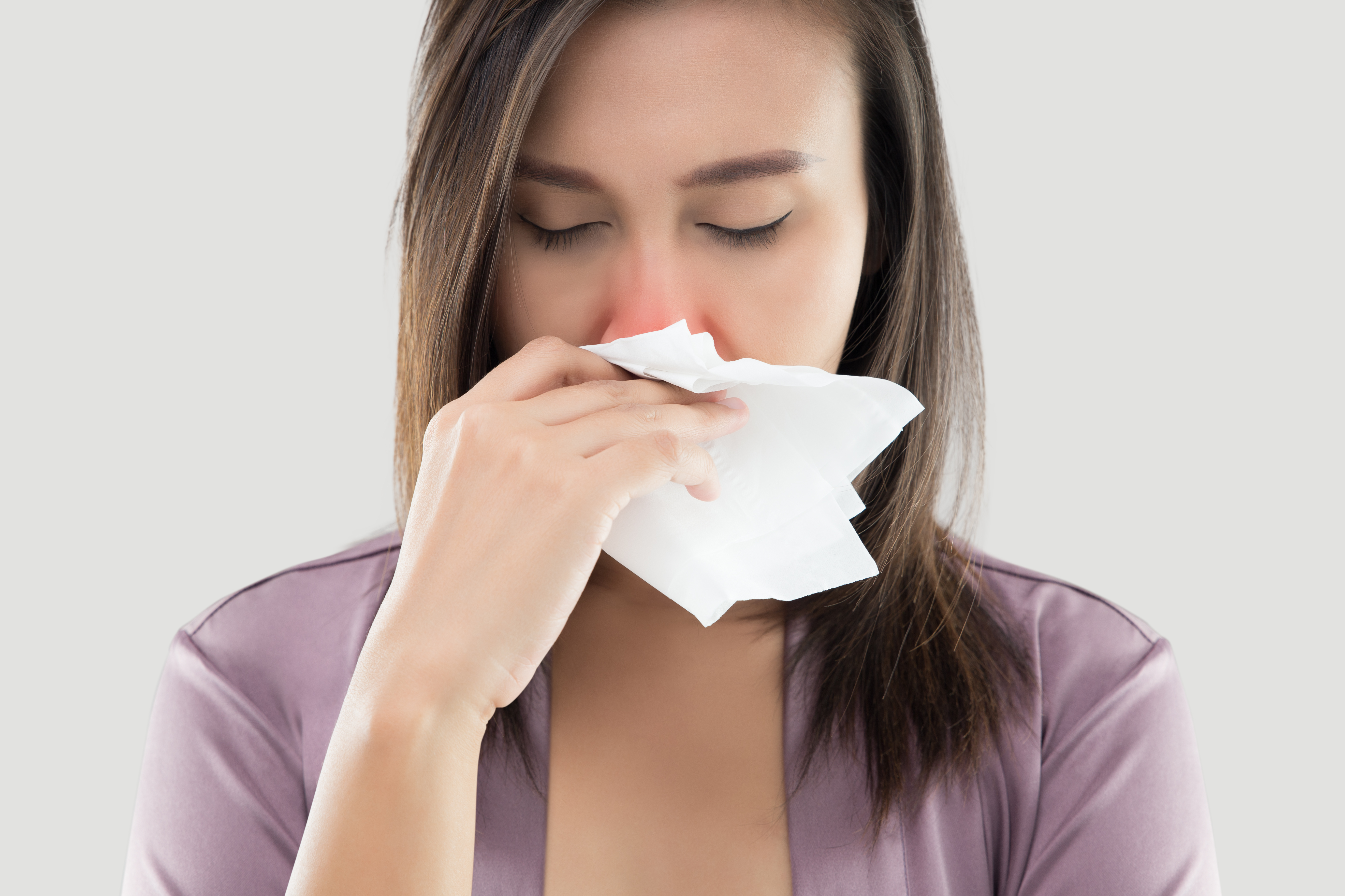 woman sneezing